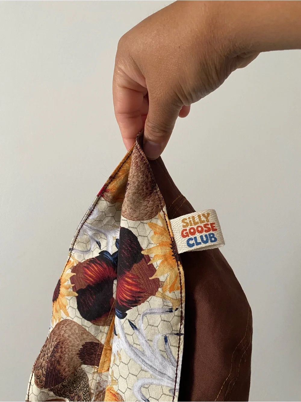 Embroidered Holland Chicken reversible bucket hat.